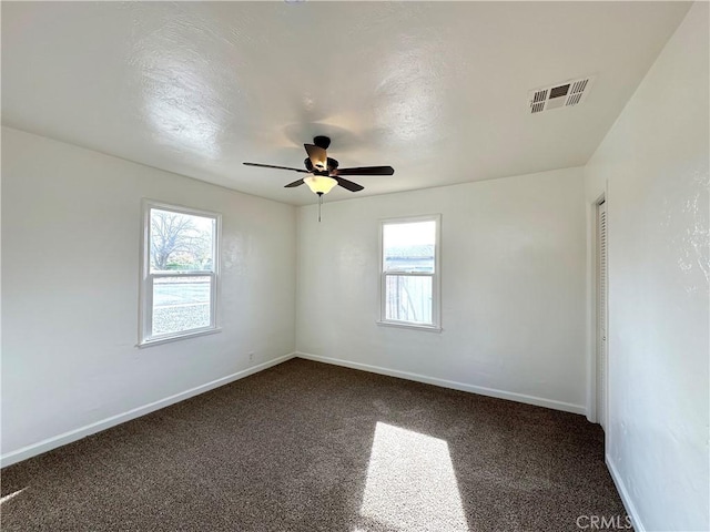 carpeted empty room with ceiling fan