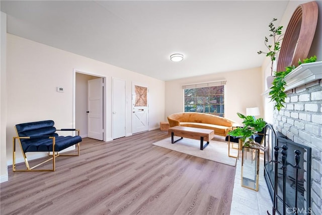 living area with light hardwood / wood-style flooring