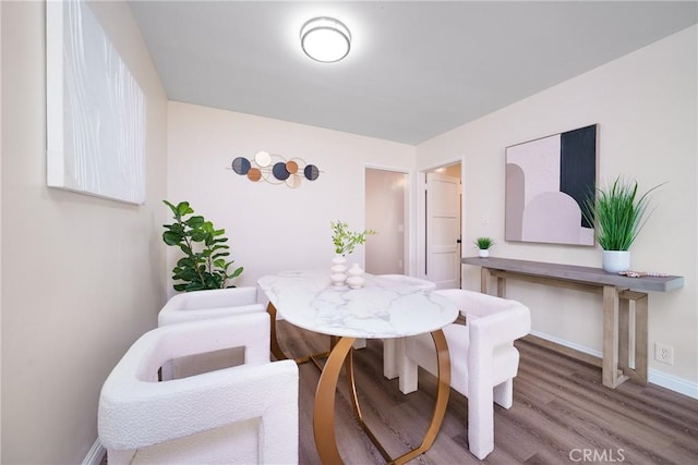 dining area featuring wood-type flooring