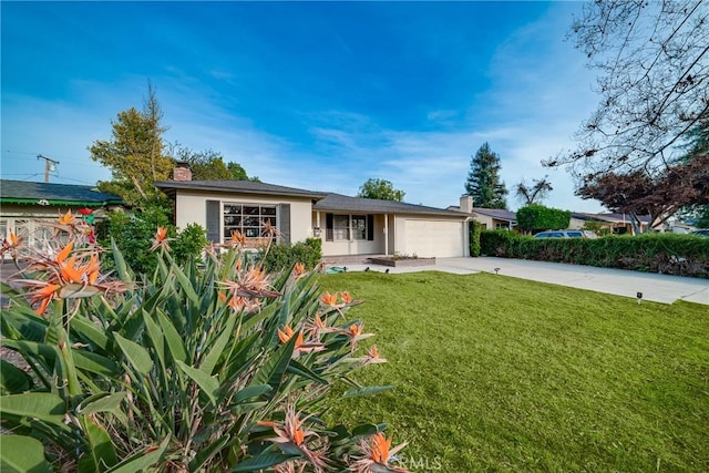 single story home featuring a front yard and a garage