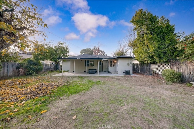 rear view of house featuring a patio area