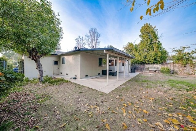 back of house featuring a patio area