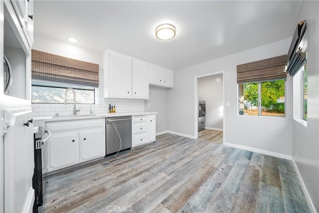 kitchen featuring sink, white cabinets, stainless steel dishwasher, and light wood-type flooring