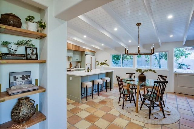 tiled dining area with wooden ceiling, beam ceiling, and a notable chandelier