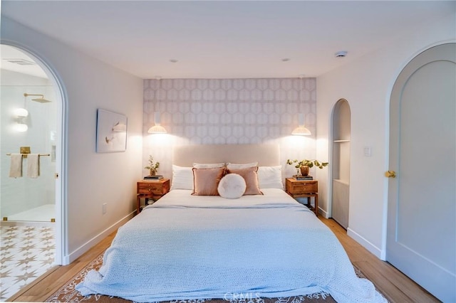 bedroom with light wood-type flooring