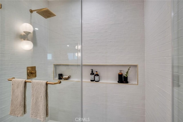 bathroom featuring an enclosed shower