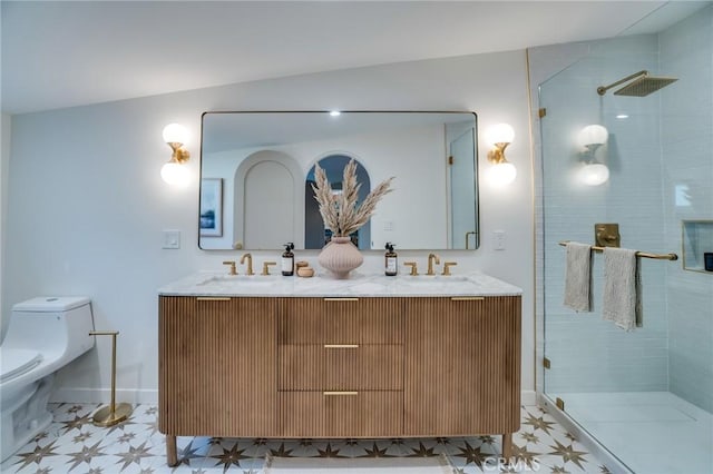 bathroom with toilet, a shower with door, and vanity