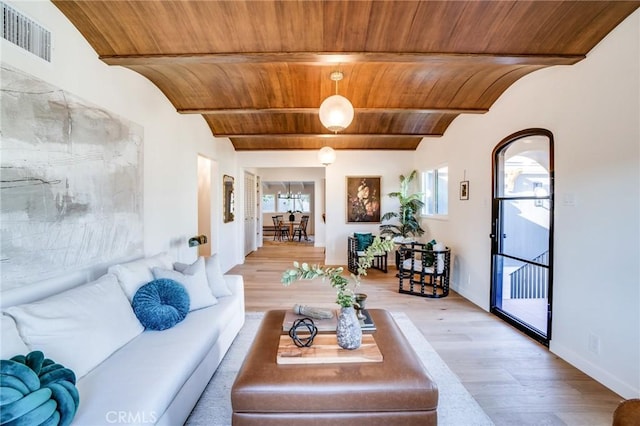 living room with wooden ceiling, light hardwood / wood-style flooring, and beamed ceiling