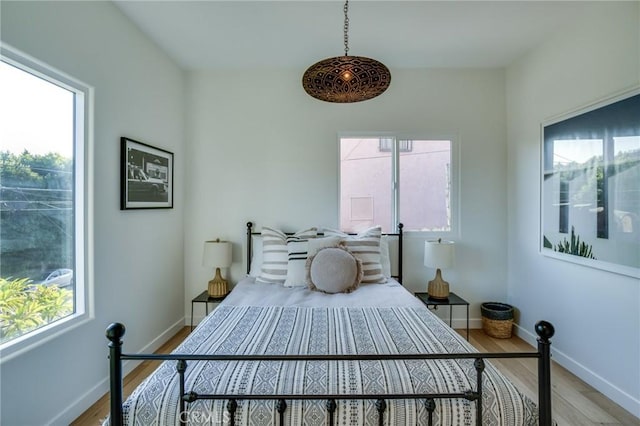 bedroom with light hardwood / wood-style floors