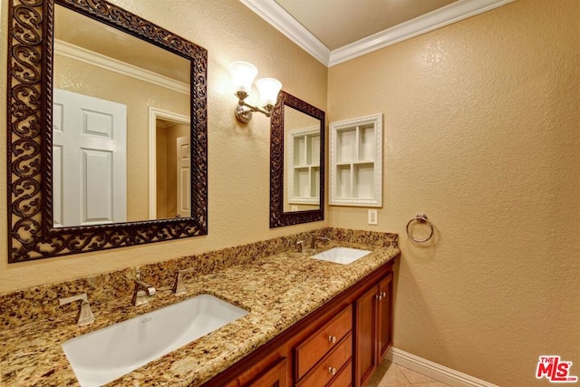 bathroom with vanity, ornamental molding, and tile patterned flooring