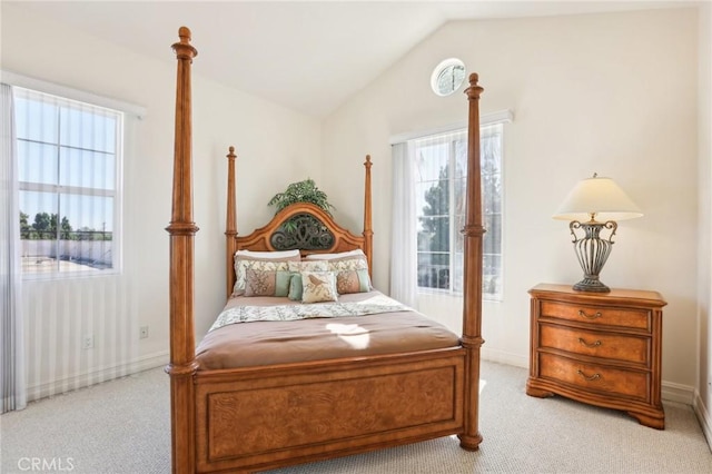 carpeted bedroom featuring vaulted ceiling