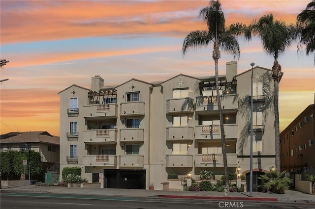 view of outdoor building at dusk