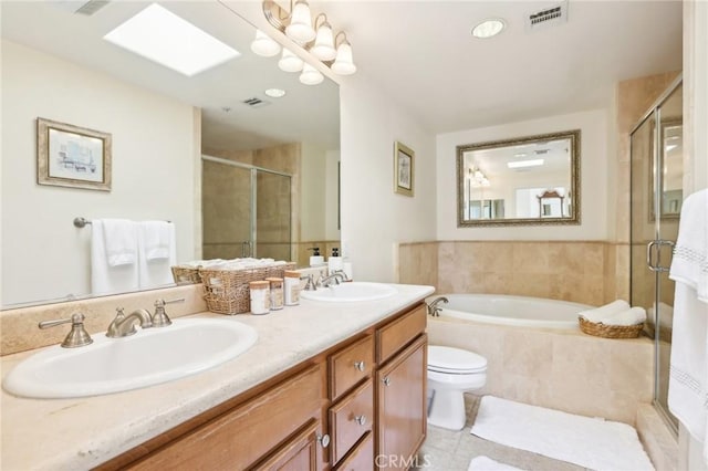 full bathroom with plus walk in shower, toilet, tile patterned flooring, and vanity