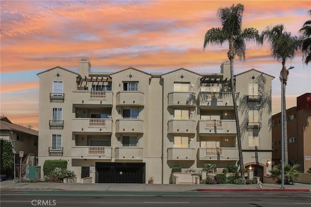 view of outdoor building at dusk