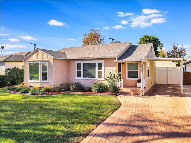 ranch-style home featuring a front yard