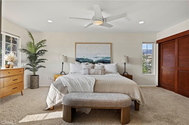 carpeted bedroom featuring ceiling fan