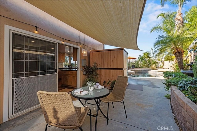 view of patio / terrace featuring a fenced in pool