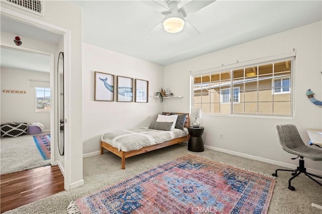 bedroom with ceiling fan and carpet floors