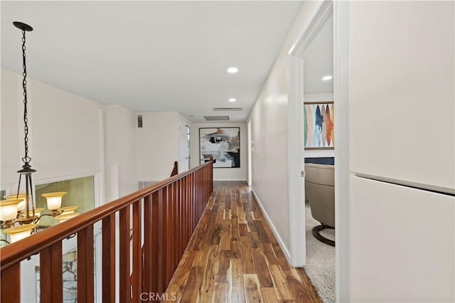 hallway with dark hardwood / wood-style flooring