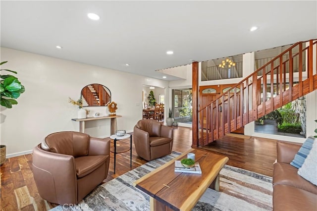 living room with a chandelier and hardwood / wood-style floors