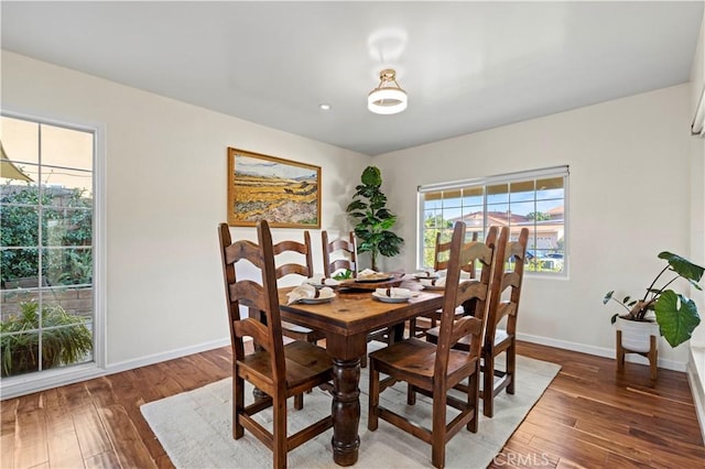 dining area featuring dark hardwood / wood-style flooring