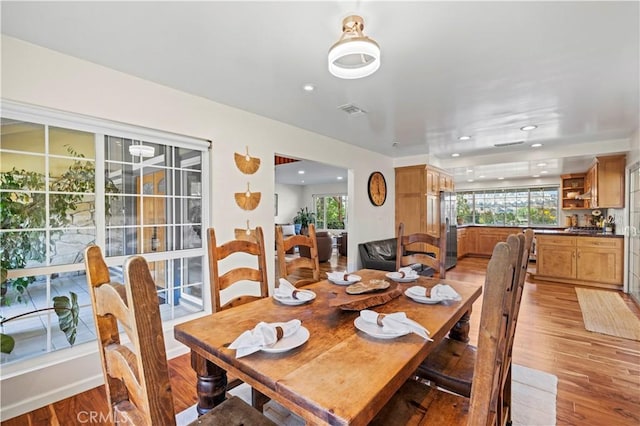 dining area with light hardwood / wood-style floors