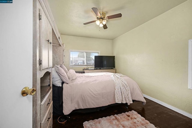 bedroom with ceiling fan and hardwood / wood-style floors