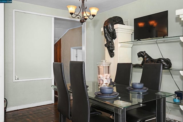 dining room featuring a chandelier and dark hardwood / wood-style flooring