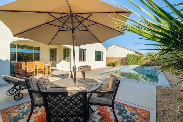 view of patio / terrace featuring a fenced in pool