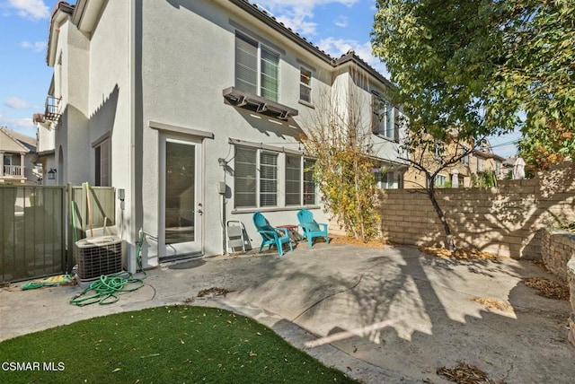 back of house featuring a patio area and central AC unit