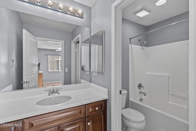 full bathroom with toilet, vanity, and bathing tub / shower combination