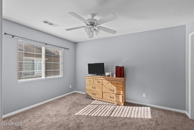 unfurnished bedroom with ceiling fan and carpet