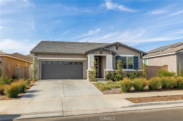 view of front of property with a garage