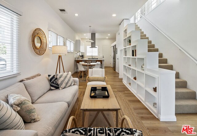 living room with light hardwood / wood-style flooring