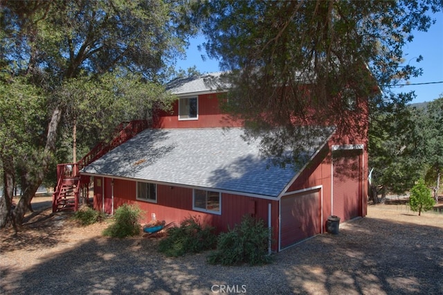 view of property exterior with a garage