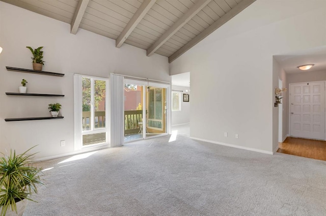 unfurnished living room featuring high vaulted ceiling, wood ceiling, beamed ceiling, and carpet flooring