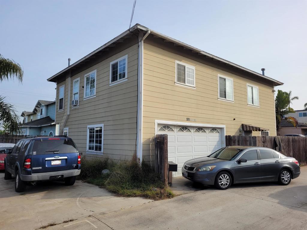 view of side of property with a garage