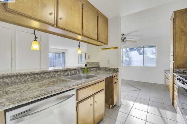 kitchen with decorative light fixtures, ceiling fan, dishwasher, sink, and light tile patterned flooring