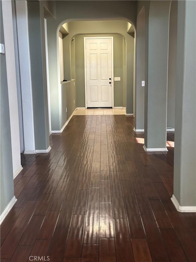 corridor with dark wood-type flooring