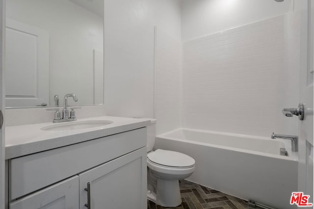 full bathroom with toilet, vanity, and washtub / shower combination