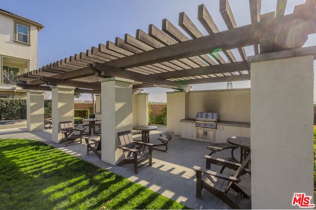 view of patio / terrace featuring a grill, an outdoor kitchen, and a pergola