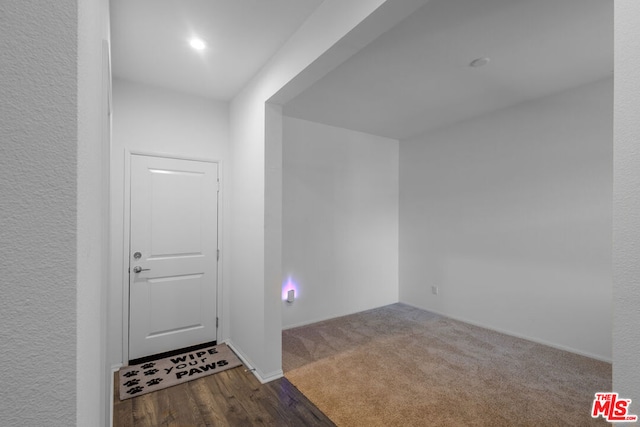 view of carpeted entrance foyer