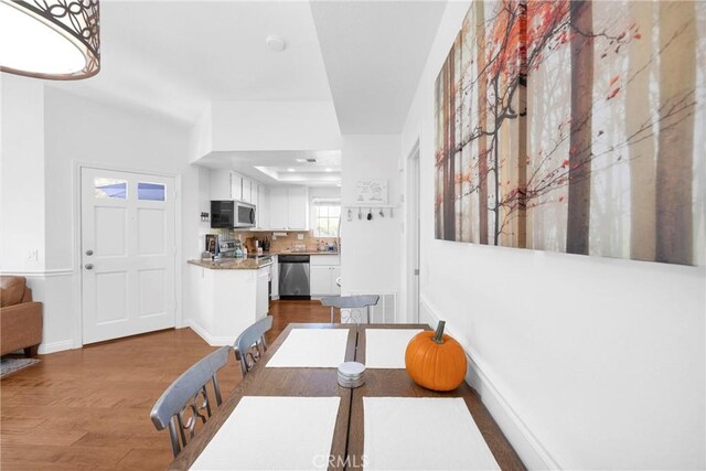 dining area featuring dark hardwood / wood-style floors