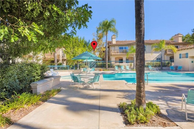 view of swimming pool featuring a patio