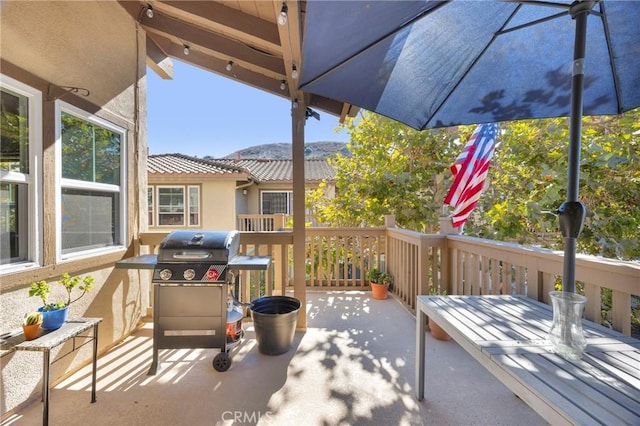 view of patio / terrace featuring area for grilling and a mountain view