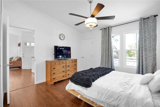 bedroom with dark wood-type flooring and ceiling fan