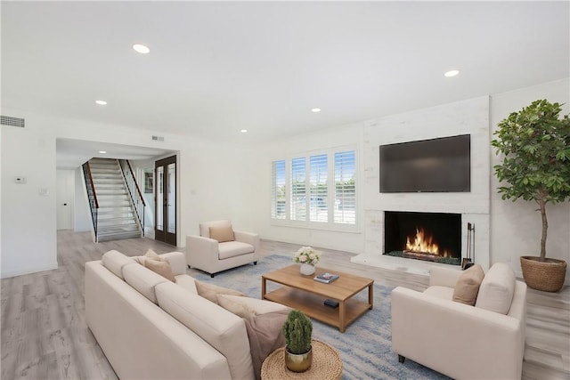 living room with light hardwood / wood-style flooring