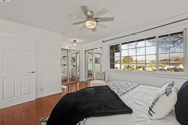 bedroom featuring dark hardwood / wood-style flooring and ceiling fan