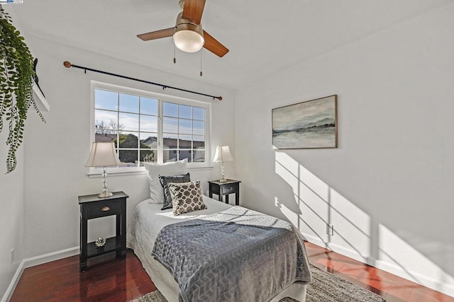 bedroom featuring ceiling fan and dark hardwood / wood-style flooring