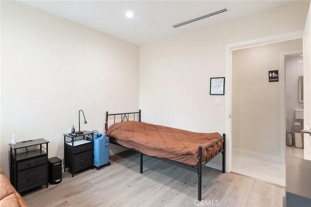 bedroom with light hardwood / wood-style floors